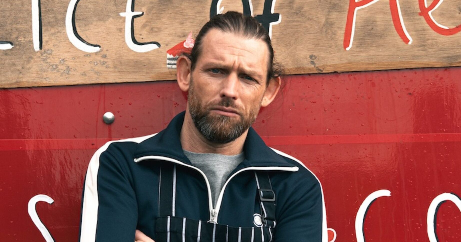 Kev posing at his new business venture in Emmerdale