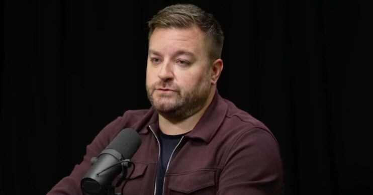 Alex Brooker on a podcast