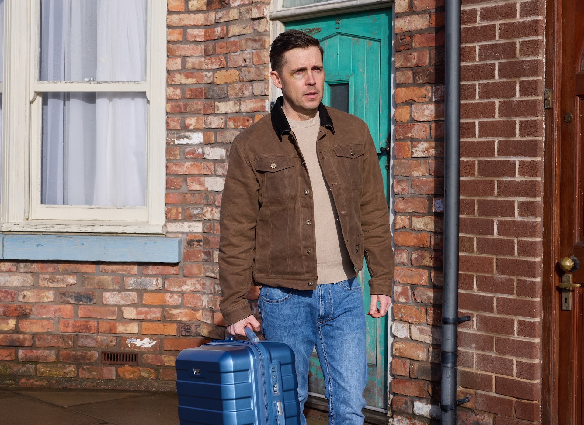 Todd with suitcase outside in Coronation Street