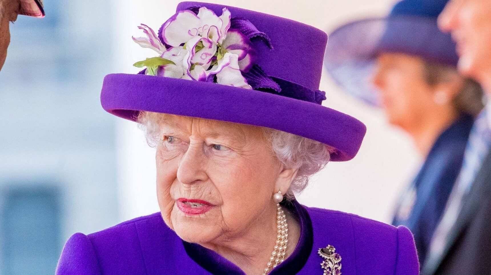 Queen Elizabeth II in purple outfit