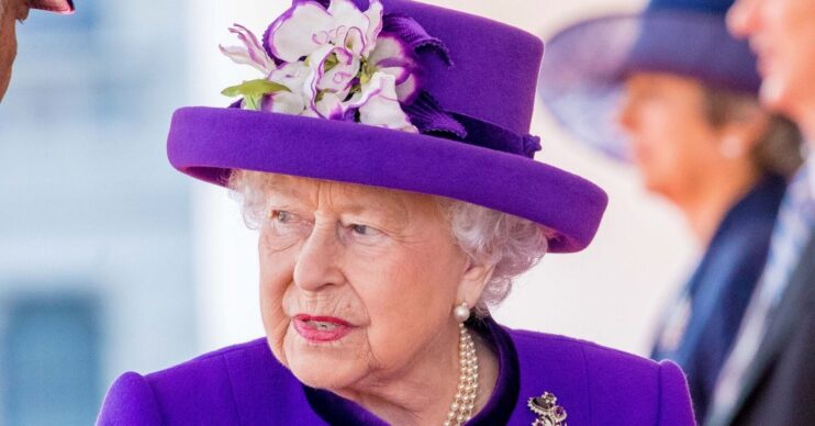 Queen Elizabeth II in purple outfit