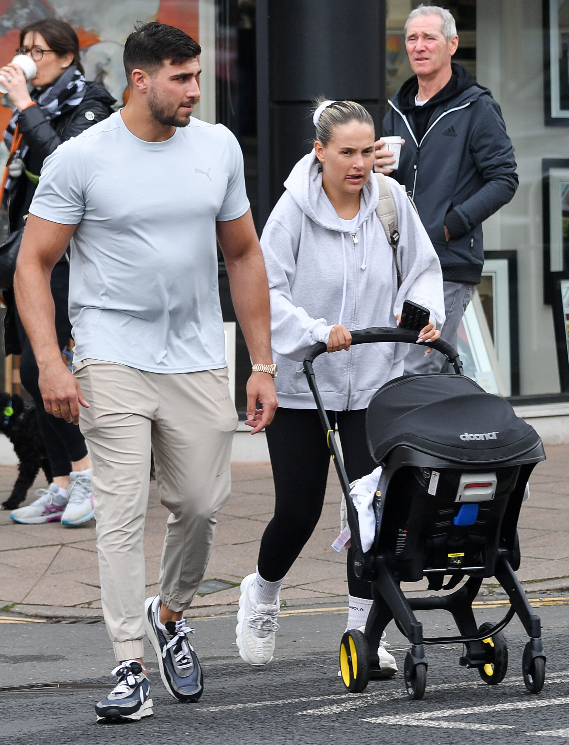 Tommy Fury and Molly-Mae Hague pushing Bambi