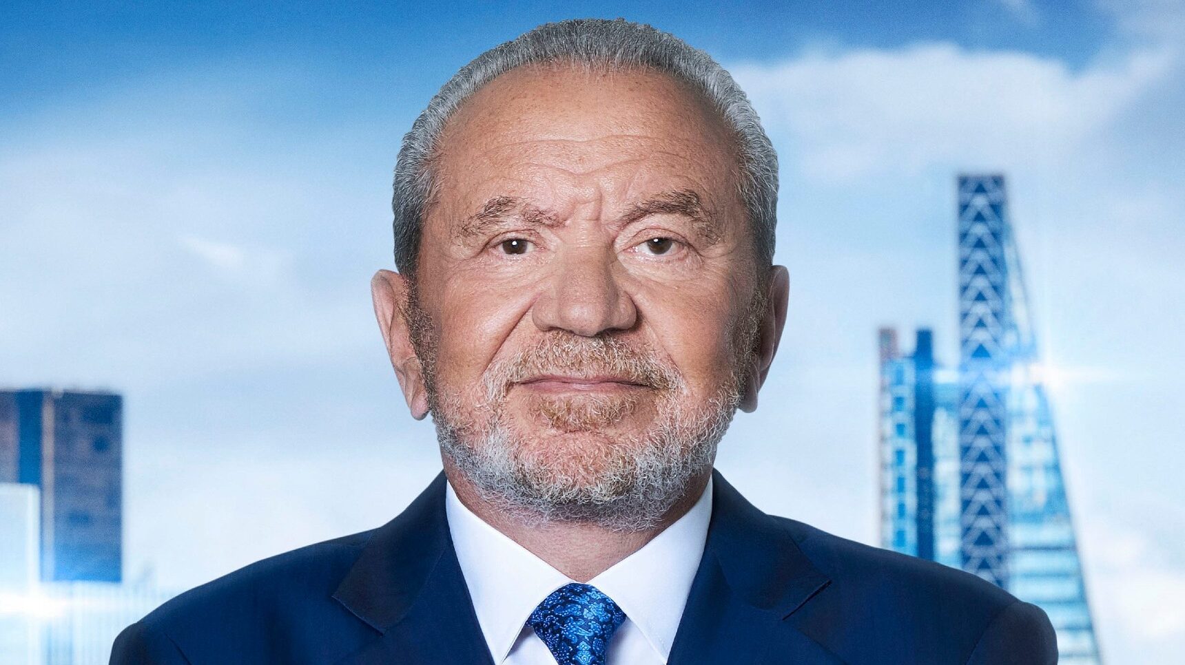 Lord Sugar smiling in The Apprentice