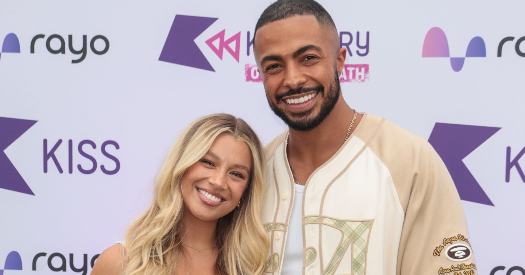 Molly Rainford and Tyler West smiling