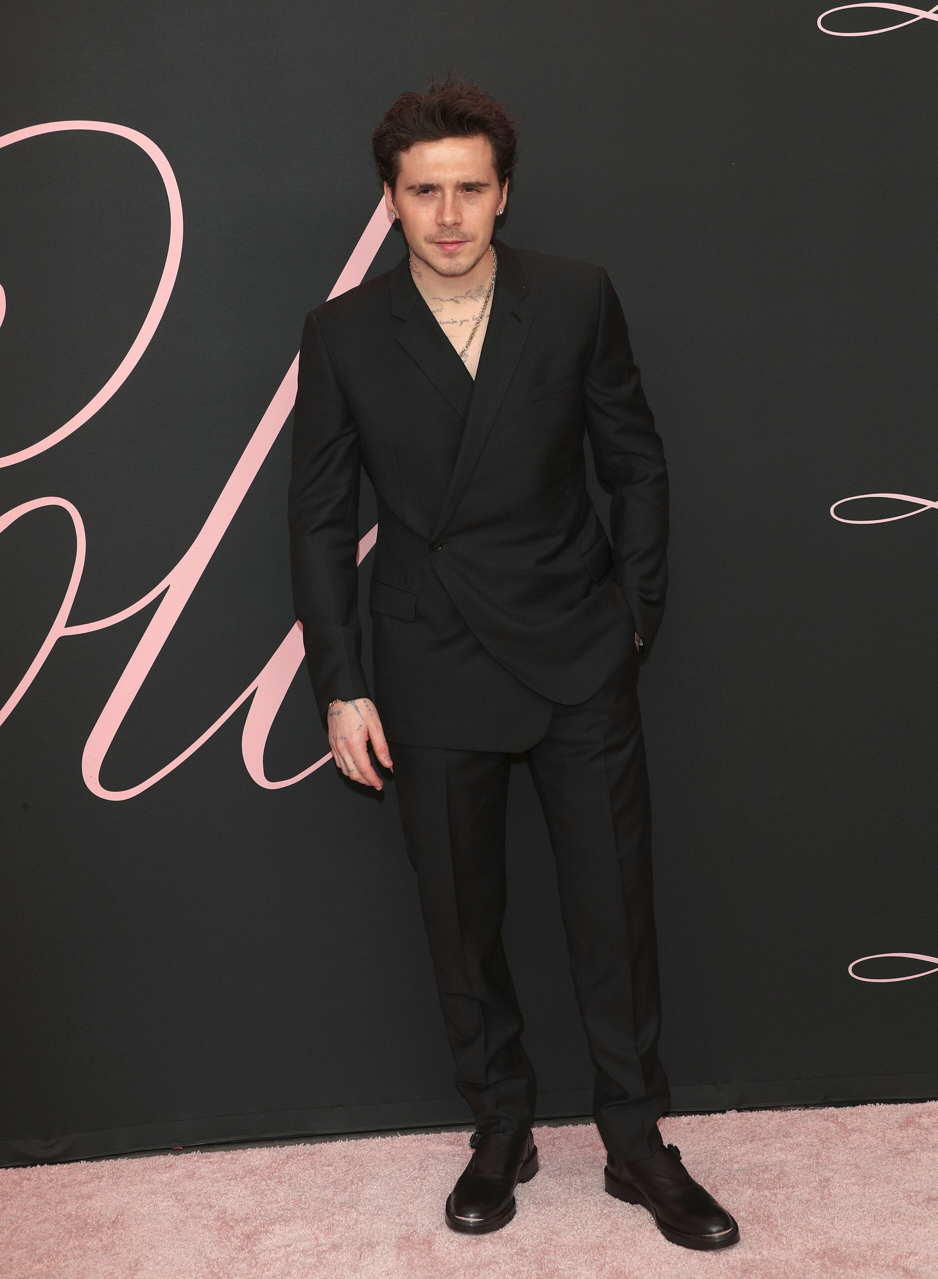 Brooklyn Beckham in a black suit
