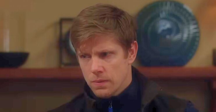 Robert looks worried in Emmerdale (Credit: ITV)