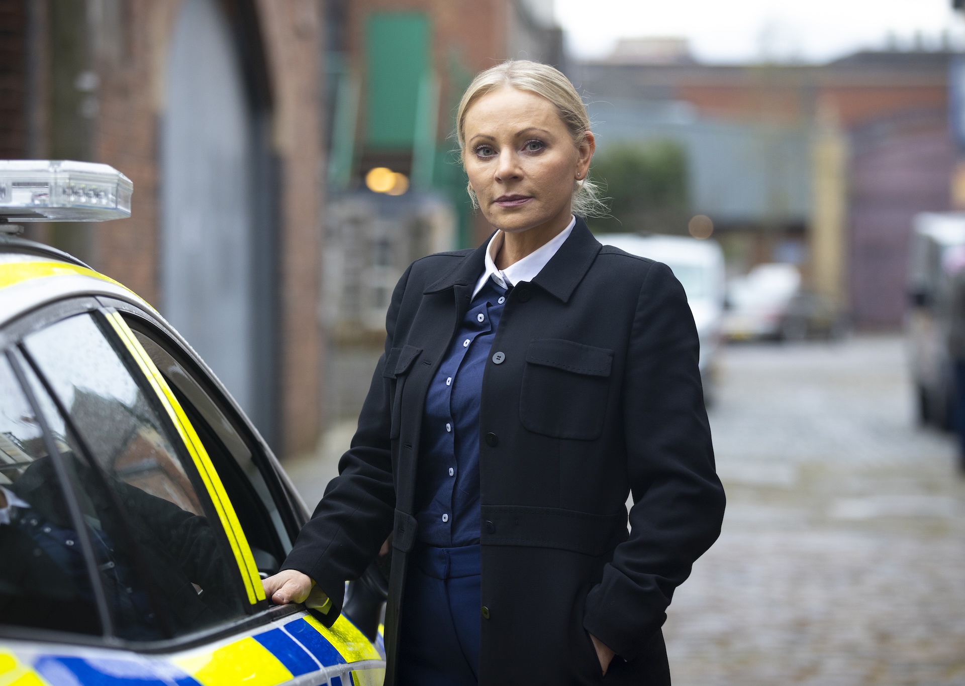 DS Lisa Swain by police car