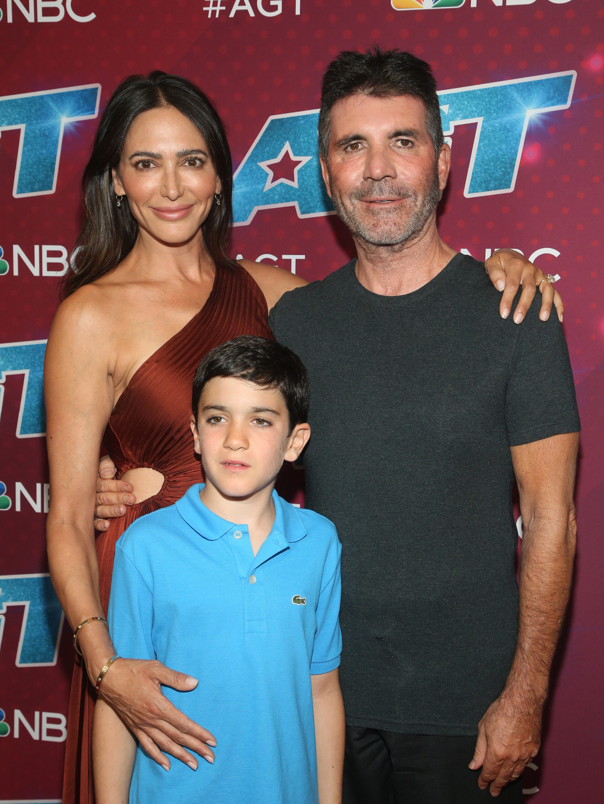 Simon Cowell, Lauren and son Eric smiling