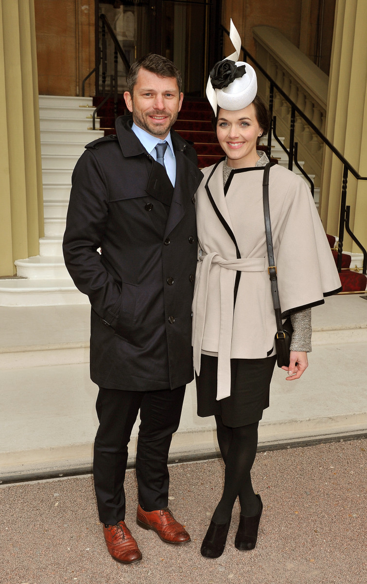  Olympic Gold Medal winning cyclist Victoria Pendleton (R) and fiance Scott Gardner as they arrive at Buckingham Palace for an Investiture Ceremony, where she will receive the Commander of the British Empire (CBE) award on March 26, 2013 in London, England. (John Stillwell - WPA Pool/Getty Images)