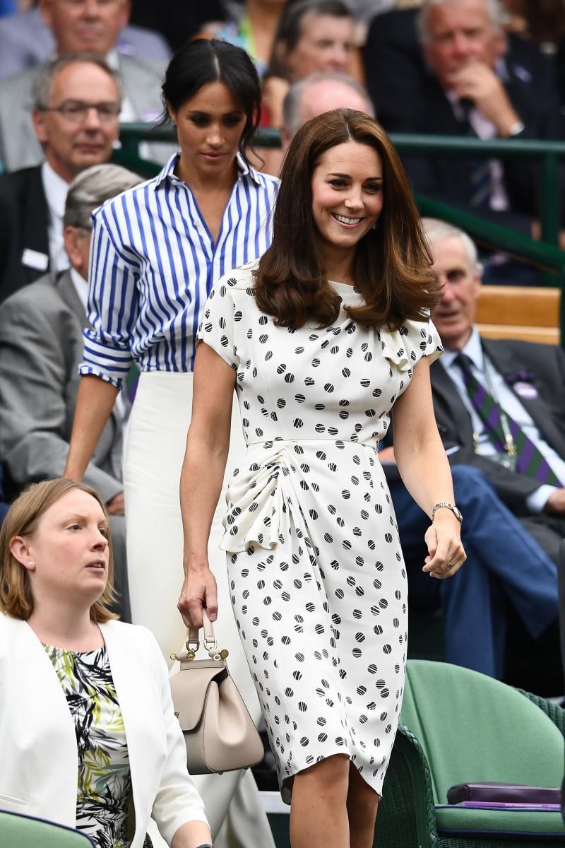 Meghan, Duchess of Sussex and Catherine, Duchess of Cambridge attend day twelve of the Wimbledon Lawn Tennis Championships at All England Lawn Tennis and Croquet Club on July 14, 2018 in London, England. (Photo by Clive Mason/Getty Images)