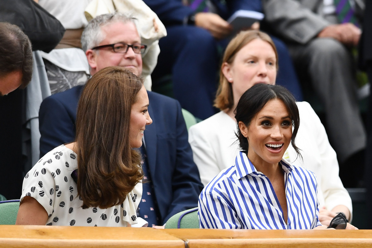 Catherine, Duchess of Cambridge and Meghan, Duchess of Sussex attend day twelve of the Wimbledon Lawn Tennis Championships at All England Lawn Tennis and Croquet Club on July 14, 2018 in London, England. (Photo by Clive Mason/Getty Images)