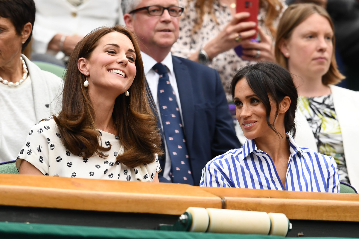 Meghan, Duchess of Sussex and Catherine, Duchess of Cambridge attend day twelve of the Wimbledon Lawn Tennis Championships at All England Lawn Tennis and Croquet Club on July 14, 2018 in London, England. (Photo by Clive Mason/Getty Images)