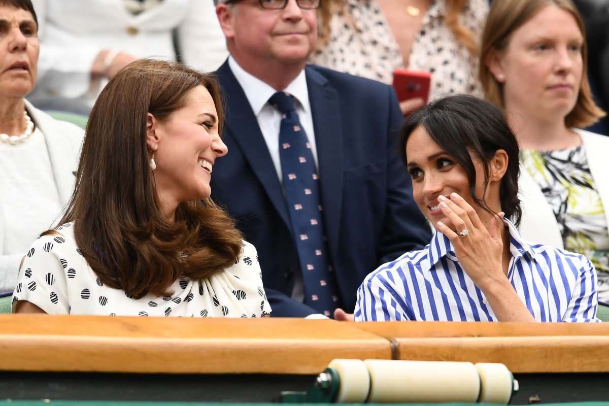 Catherine, Duchess of Cambridge and Meghan, Duchess of Sussex attend day twelve of the Wimbledon Lawn Tennis Championships at All England Lawn Tennis and Croquet Club on July 14, 2018 in London, England. (Photo by Clive Mason/Getty Images)