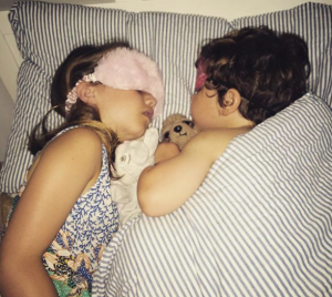 Two children asleep in bed