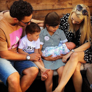 Adam thomas with his children and wife and niece, Scarlett