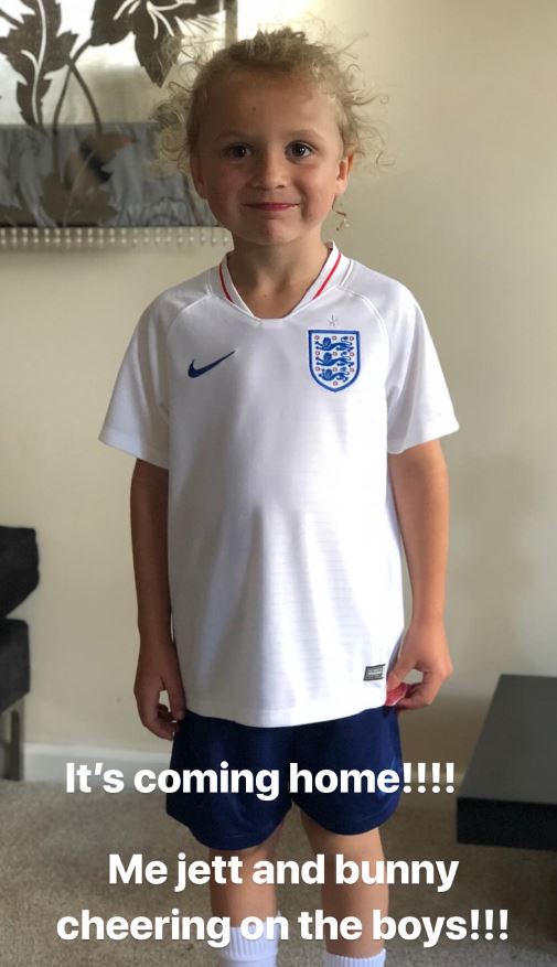 Kieran Hayler watches England's World Cup semi final with children Bunny and Jett