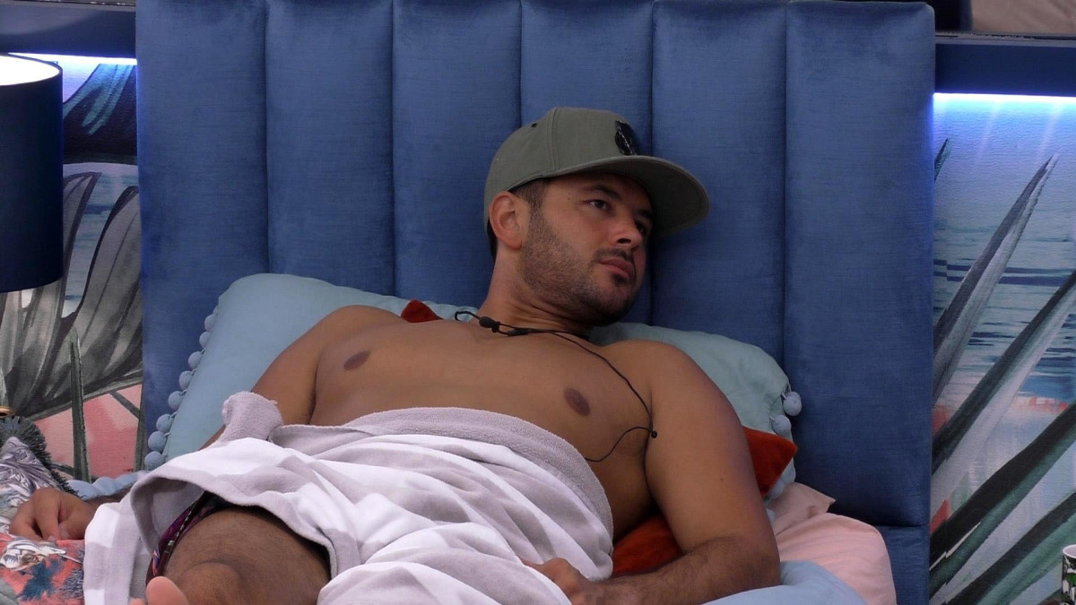 Ryan Thomas lying on a bed
