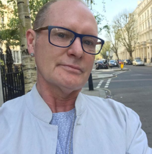 Paul Gascoigne poses outdoors in a shirt and tie in April 2018 
