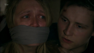 Emmerdale's Rebecca White stuffed in a suitcase