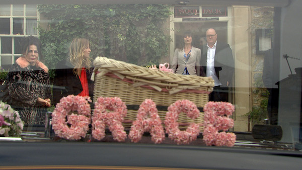 Chas and Paddy are devastated at Grace's funeral casket with pink flowers spelling her name 