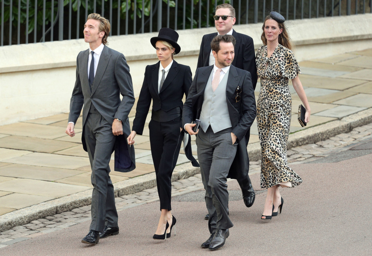 Cara Delevingne (C) arrives ahead of the wedding of Princess Eugenie of York and Mr. Jack Brooksbank at St. George's Chapel on October 12, 2018 in Windsor, England. (Photo by Aaron Chown - WPA Pool/Getty Images)