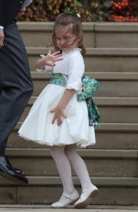 Bridesmaid Princess Charlotte of Cambridge waves as she arrives ahead of the wedding of Princess Eugenie of York and Mr. Jack Brooksbank at St. George's Chapel on October 12, 2018 in Windsor, England. (Photo by Steve Parsons - WPA Pool/Getty Images)