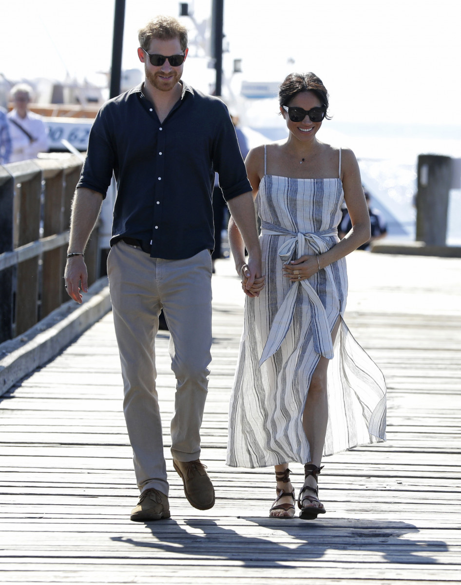 Meghan, Duchess of Sussex and Prince Harry, Duke of Sussex walk along Kingfisher Bay Jetty during a visit to Fraser Island on October 22, 2018 on Fraser Island, Australia. The Duke and Duchess of Sussex are on their official 16-day Autumn tour visiting cities in Australia, Fiji, Tonga and New Zealand. (Photo by Kirsty Wigglesworth - Pool/Getty Images)
