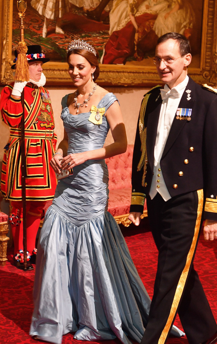 Catherine, Duchess of Cambridge walks with Rear Admiral Ludger Brummelaar during a State Banquet at Buckingham Palace on October 23, 2018 in London, United Kingdom. King Willem-Alexander of the Netherlands accompanied by Queen Maxima are staying at Buckingham Palace during their two day stay in the UK. The last State Visit from the Netherlands was by Queen Beatrix and Prince Claus in 1982. (Photo by John Stillwell - WPA Pool/Getty Images)