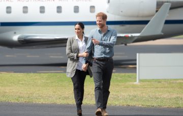 Prince Harry, the Duke of Sussex and Meghan, the Duchess of Sussex arrive at Dubbo Airport