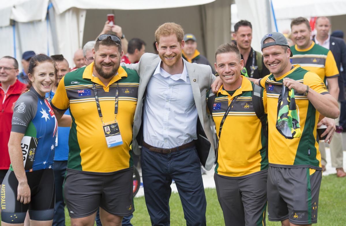 Prince Harry, the Duke of Sussex is presented with a pair of Invictus underwear by the Australian team during the Invictus Games cycling time trial in Sydney
