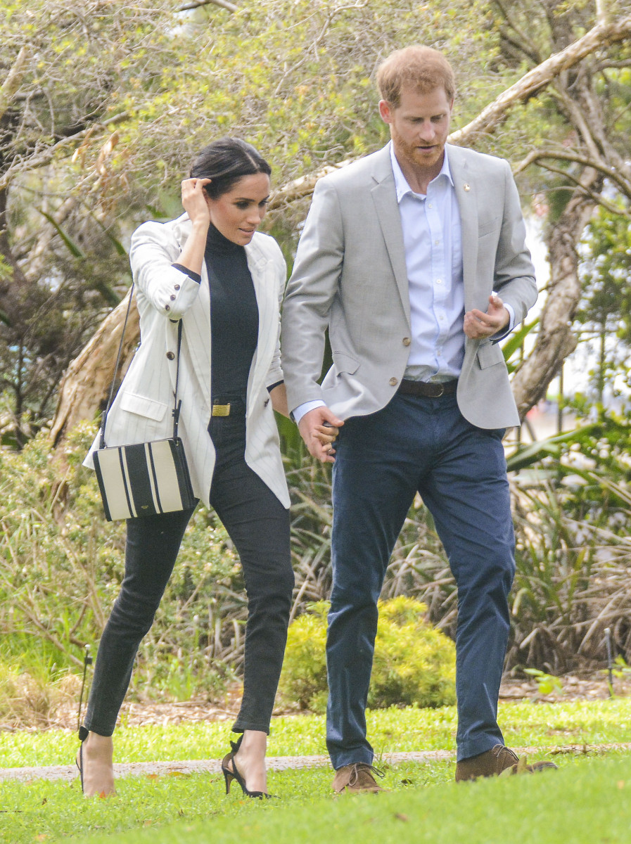 Meghan Markle arrives at Invictus Luncheon with Prince Harry, after missing morning events