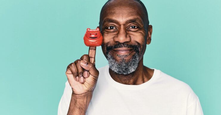 Lenny Henry posing with a red nose for Comic Relief 2022