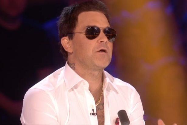 Robbie Williams dressed as Simon Cowell for the Halloween show