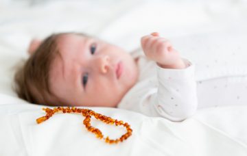 Toddler with teething necklace