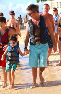 Simon Cowell pets a monkey on the beach in Barbados. The couple went for a jet ski ride with son Eric as they continued their sunsoaked vacation in the Caribbean.