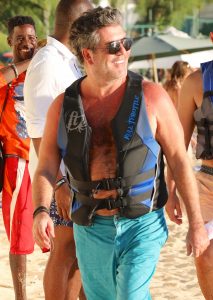 Simon, Lauren and Eric go on a jet ski ride in Barbados. Eric is also seen petting a baby monkey.