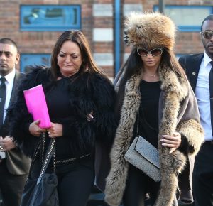 Katie holds on as she walks to court