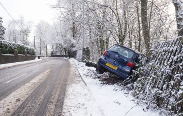 Chilly Tuesday in Scotland Caption : A car is seen crashed in Callander as Scotland is decended into "Chilly Tuesday" with sub zero temperatures, ice, and snow PersonInImage : car crash Credit : Euan Cherry/WENN