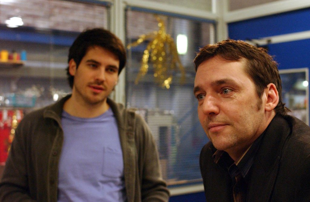 Editorial use only. Exclusive - Premium Rates Apply. Call your Account Manager for pricing. Mandatory Credit: Photo by ITV/REX/Shutterstock (764166ll) 'Coronation Street' TV - 2006 - Paul Connor [SEAN GALLAGHER] tells brother Liam Connor [ROB JAMES-COLLIER-[left]] he's his new partner in the factory. ITV ARCHIVE