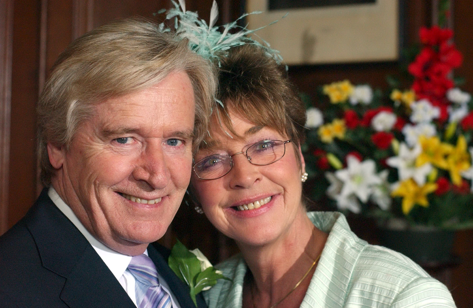 Ken and Deridre smiling on their wedding day in Corrie