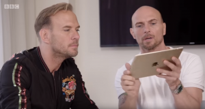 Luke, holding the tablet, and his twin brother Matt in Bros: After The Screaming Stops (Credit: BBC)