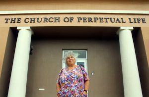 Programme Name: Miriam’s Dead Good Adventure - TX: 21/04/2019 - Episode: n/a (No. 1) - Picture Shows: at the Church of Perpetual Life in Hollywood - Florida, USA Miriam Margolyes - (C) Wild Pictures - Photographer: Production