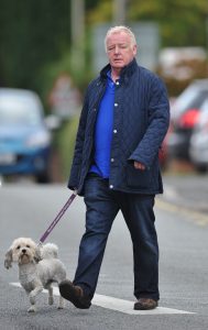 Les Dennis takes his dog for a walk