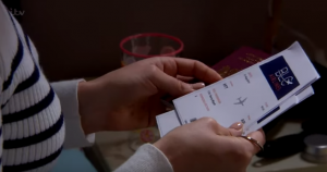 Tracy also finds Kerry's passport and flight information Emmerdale 