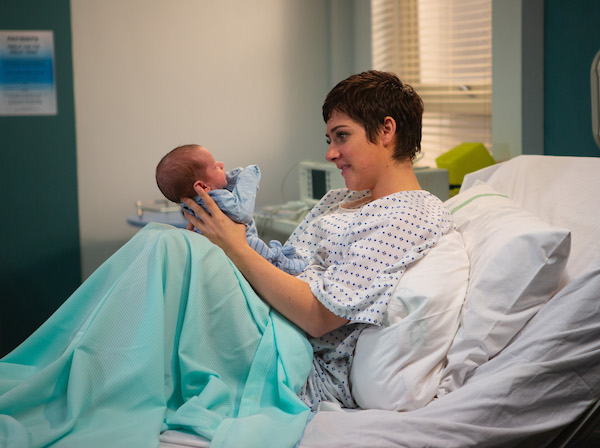Victoria gazes adoringly at baby Harry in Emmerdale