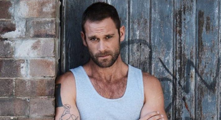 Jake Ryan as Robbo in Home And Away