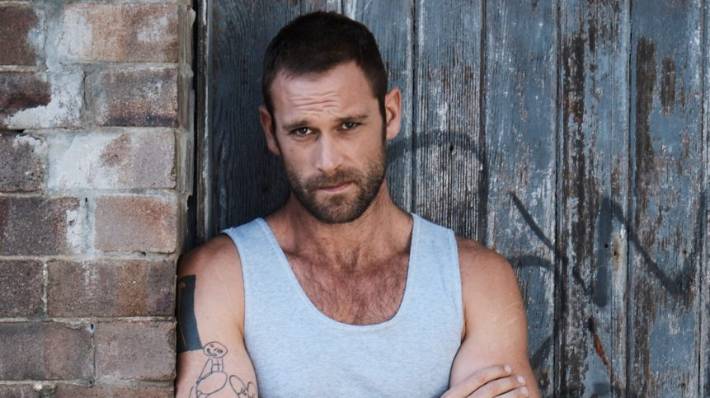 Jake Ryan as Robbo in Home And Away