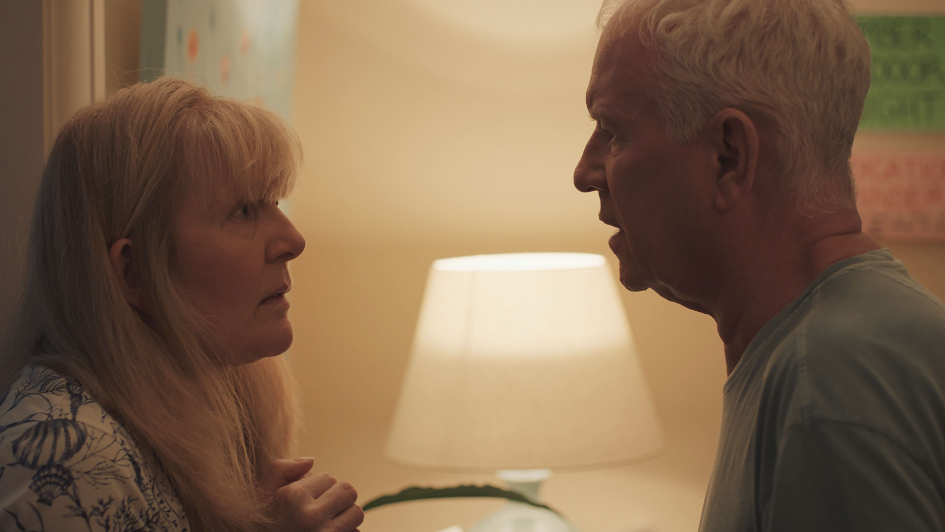Duffy and Charlie stare at each other concerned in a Casualty scene