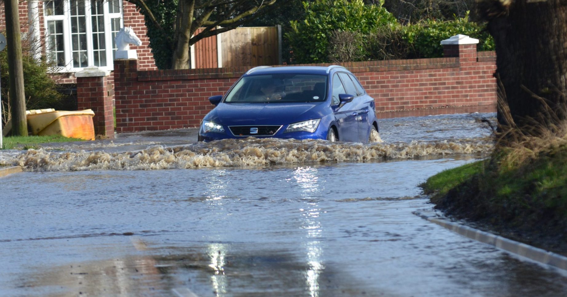 Car driving through flood water
