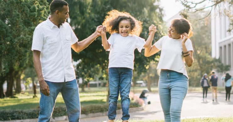 Mother, father and daughter playing. Households all over UK to get council tax holiday as authorities roll out coronavirus support measures